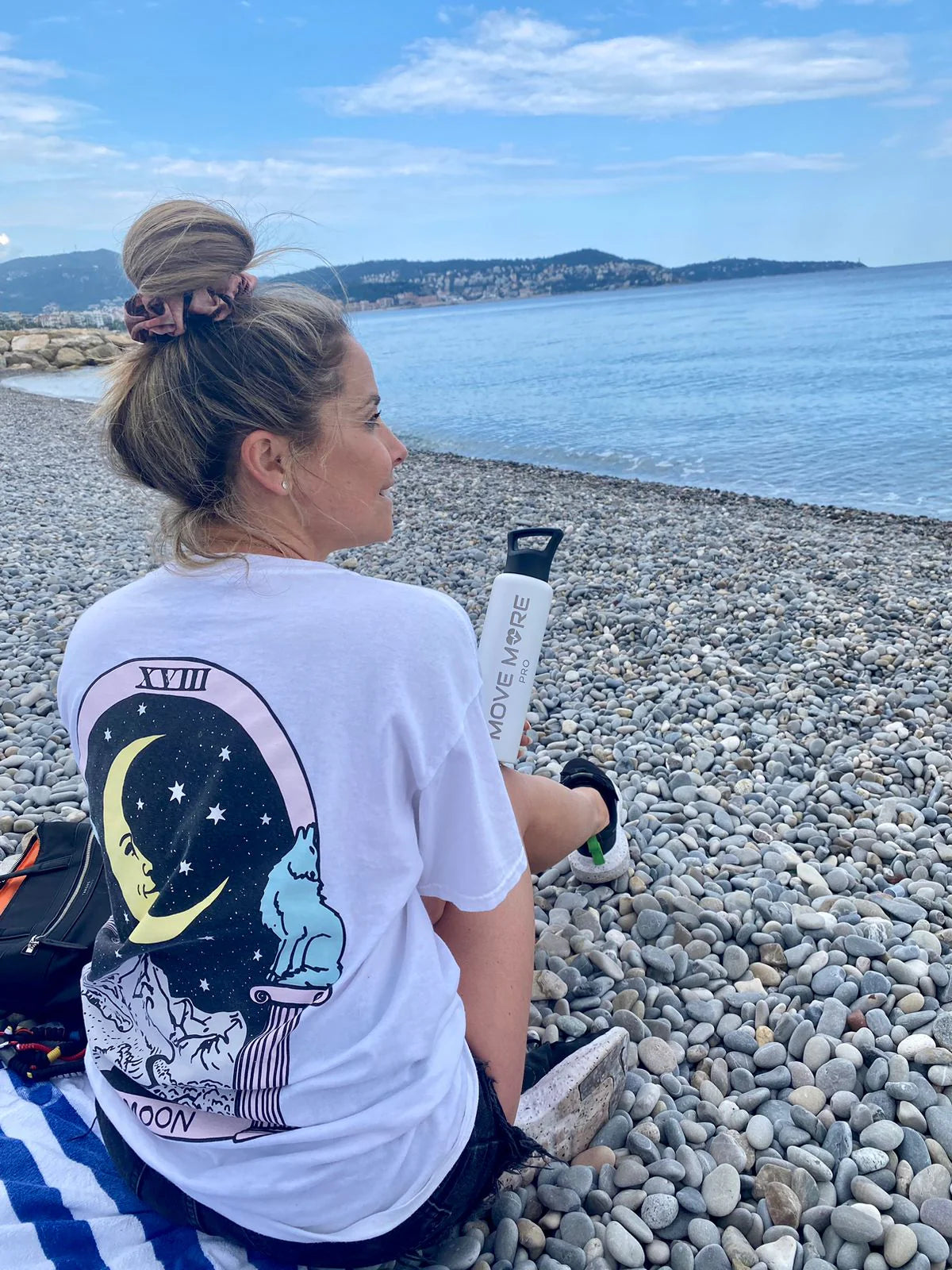 At the beach with the white bottle