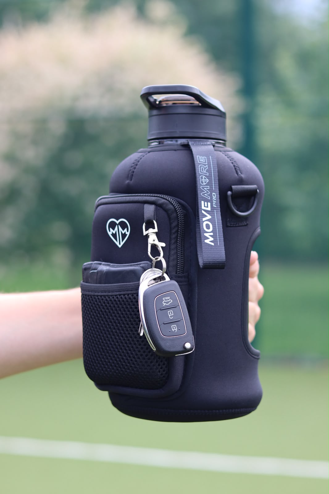 Move More Pro held with car keys clipped on