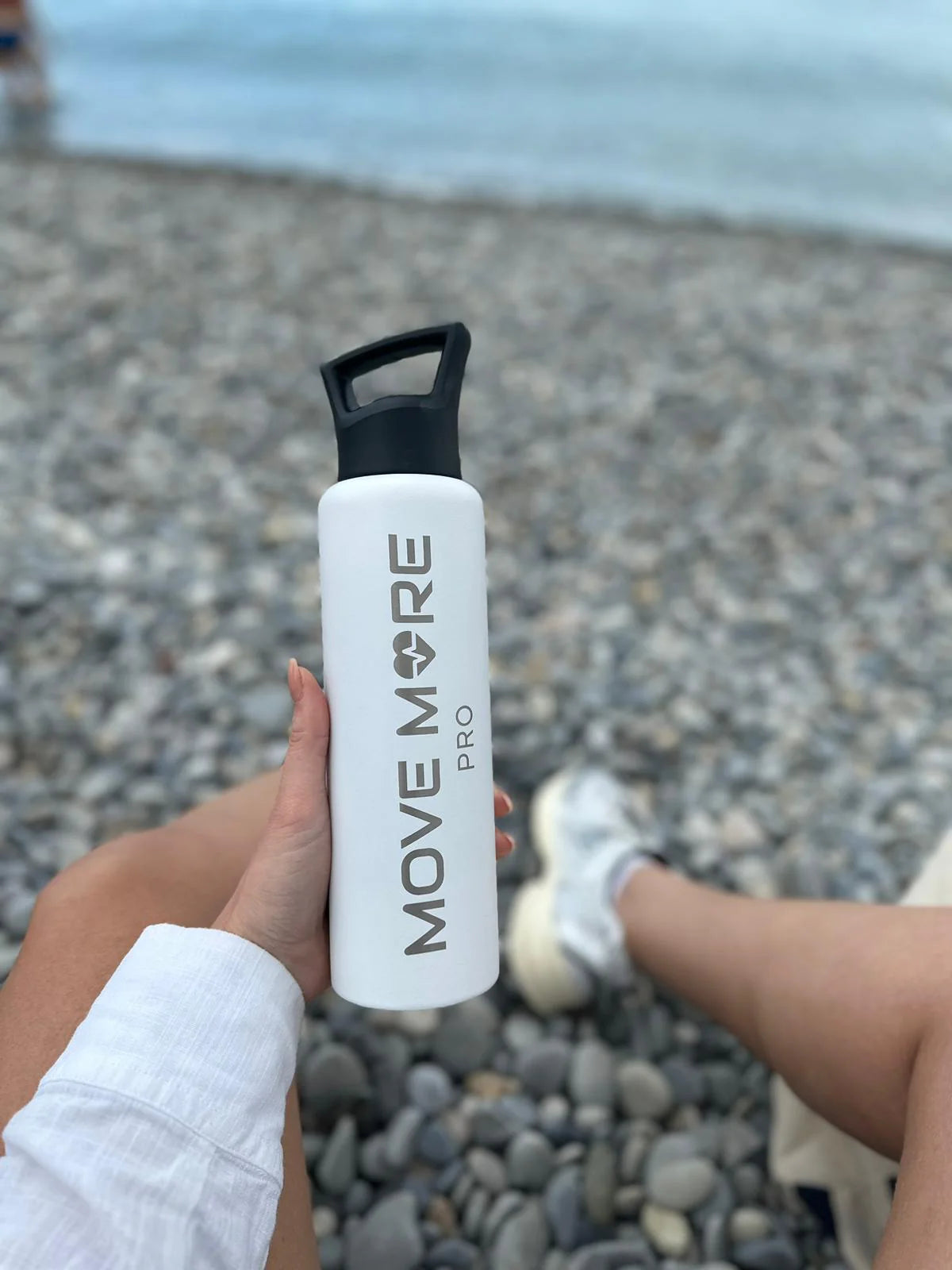 White bottle by the sea