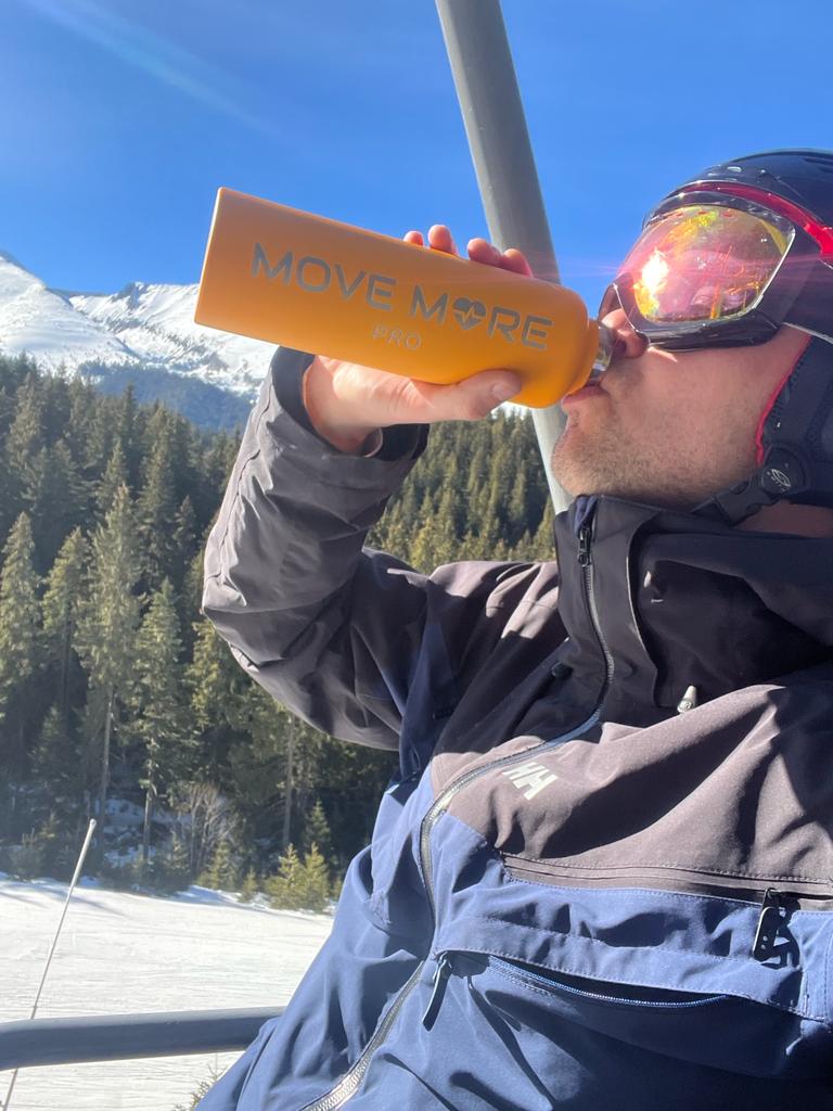 Drinking from the yellow bottle on the slopes